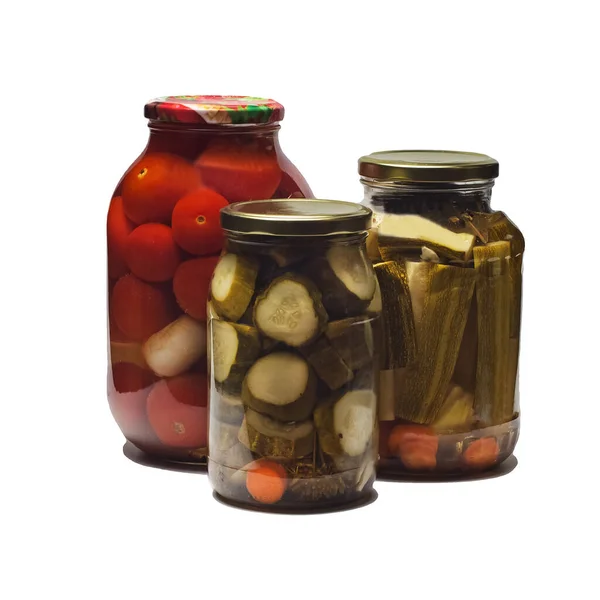 set of canned pickled vegetables in jars - cucumbers, tomatoes, zucchini. Preparation for the winter. Homemade food. Close-up, selective, focus