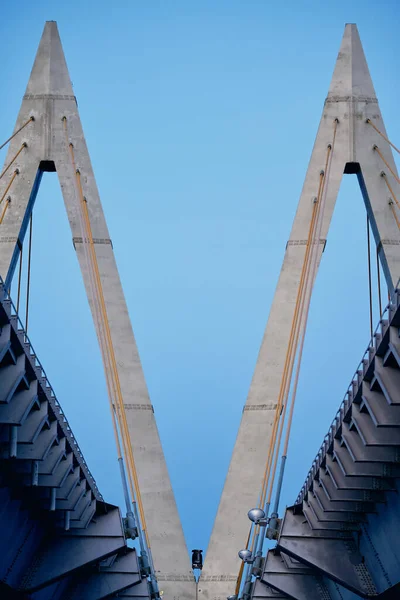 part of traffic bridge made of concrete. Blue sky on background. Close up image. Concept of construction and engineering.