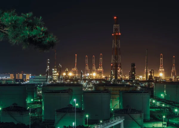 Two berths with oil refinery tanks and mega-gantry cranes make up the Minami-Honmoku Pier as seen from Honmoku Waterfront Park.