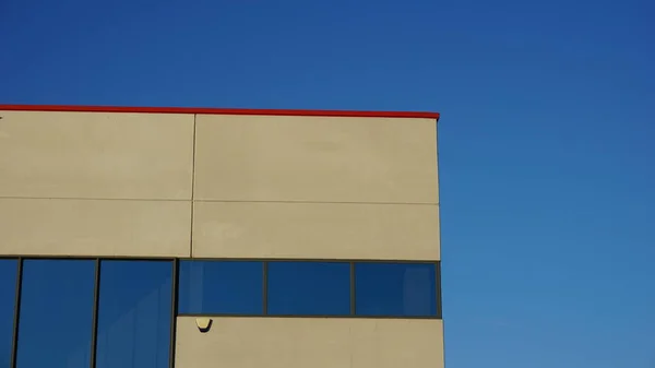 industrial building facade against blue background