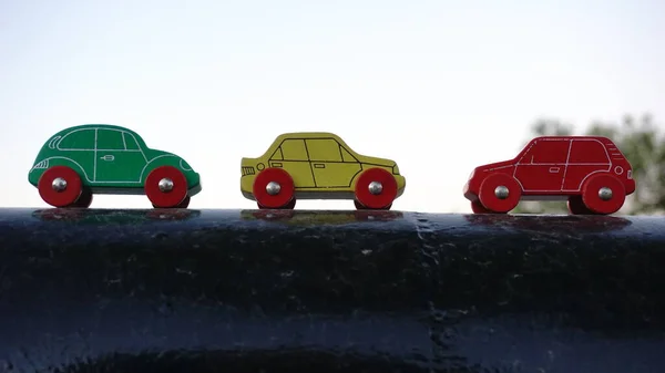 wood toy cars of different colors