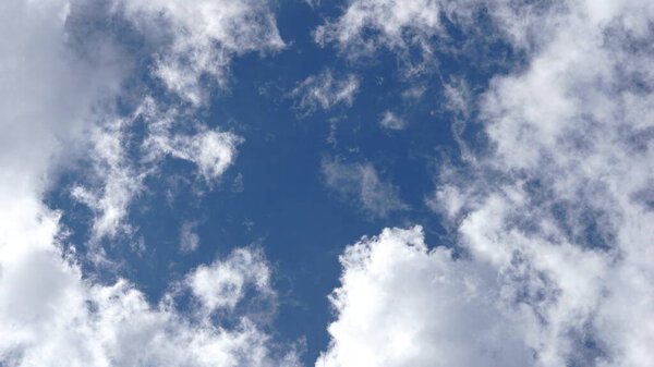 White clouds against blue background