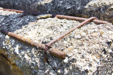 Damaged concrete caused by rusting reinforcement bars clipart