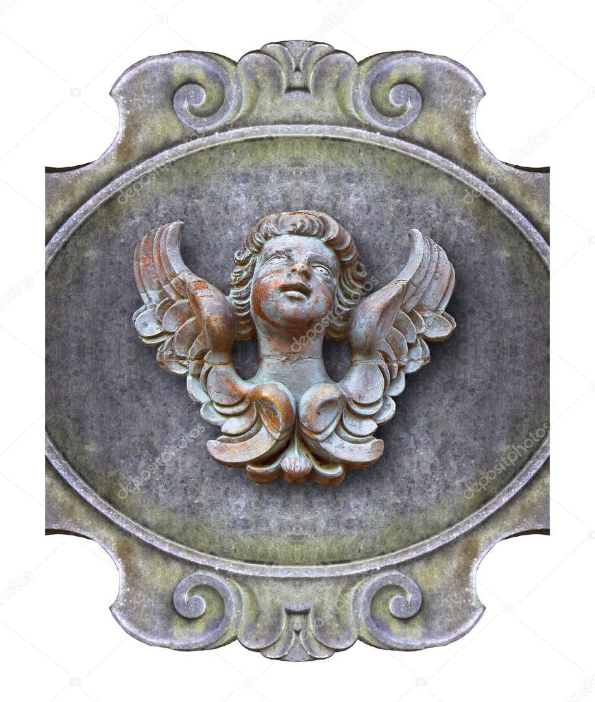 Sculpture of a wooden angel against an old classical plaster fra