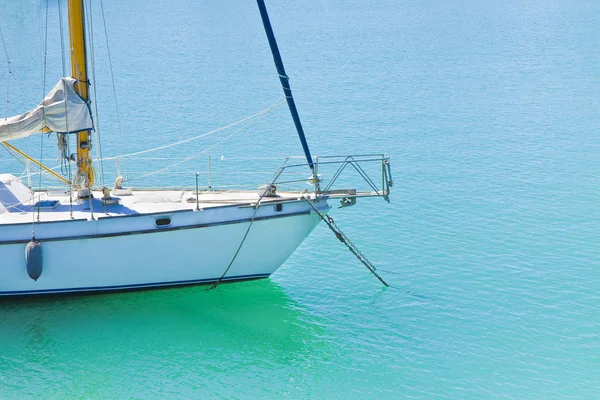 stock image White sail boat moored - image with copy space