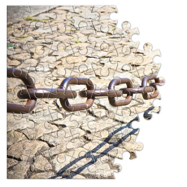 Old rusty metal chain - freedom concept image in jigsaw puzzle s — Stock Photo, Image