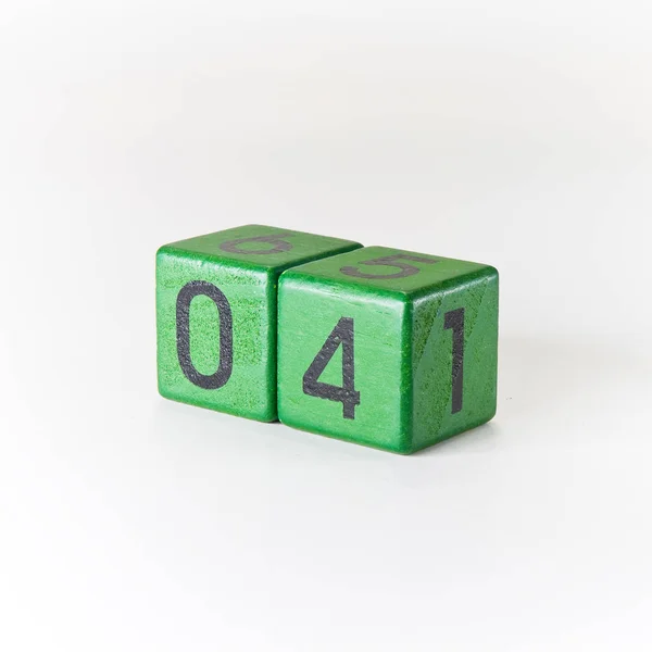 Number four written on a wooden green cube — Stock Photo, Image