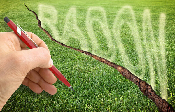 A cracked green mowed lawn with radon gas escaping - concept ima