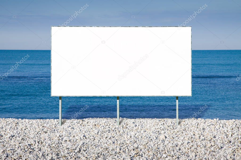 Blank advertising billboard against a seascape background - imag