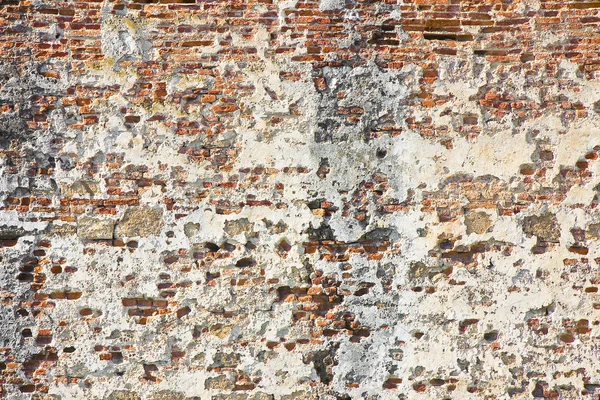 Bozulmuş sıva ile eski İtalyan taş ve tuğla duvar — Stok fotoğraf