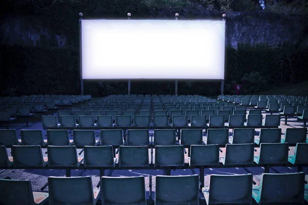 Outdoor cinema with white projection screen - toned image