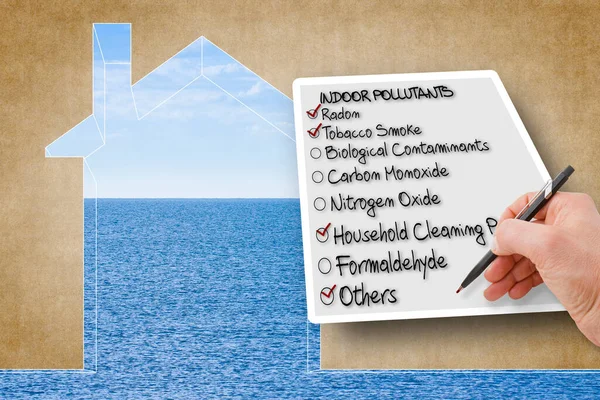 Hand write a check list of indoor air pollutants - concept image against the purity of a natural background.