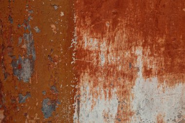 kırmızı turuncu alçılı eski boyanmış beton duvar