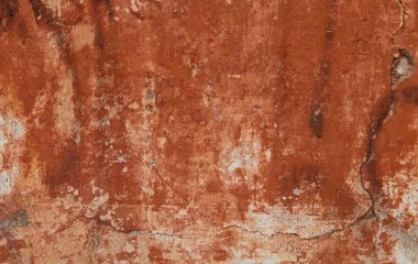 kırmızı turuncu alçılı eski boyanmış beton duvar