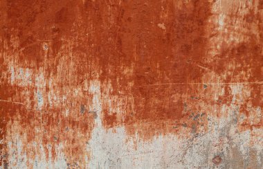 kırmızı turuncu alçılı eski boyanmış beton duvar