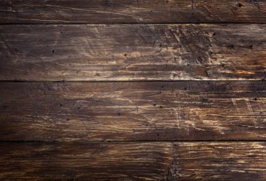 Kahverengi ahşap çizilmiş masa başı dokusu. Soyut arkaplan, boş şablon, metin alanı.