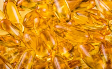 Balık yağı, portakal sarısı yumuşak kapsüller, balık yağı, omega-3, omega-9, A vitamini, D vitamini, E vitamini. Sağlıklı vitaminler ürün konsepti
