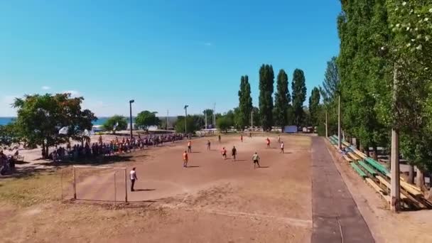 A group of men plays football on the Black Sea in Odessa. Aerial view. Top view — Stock Video