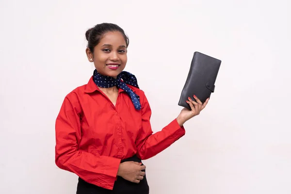 Young charming air hostess showing black passport case.