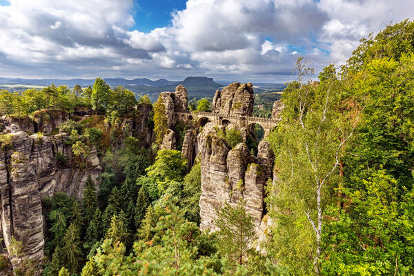 Bastei, view of the Bastei bridge and stone gate. Bastei is famous for the beautiful rock formation in the Saxon Switzerland National Park near Dresden. Popular travel destination in Saxony