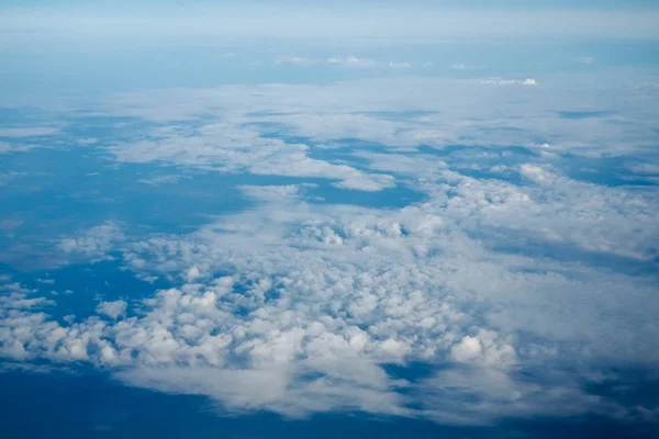 Clouds and blue sky, a view from airplane window