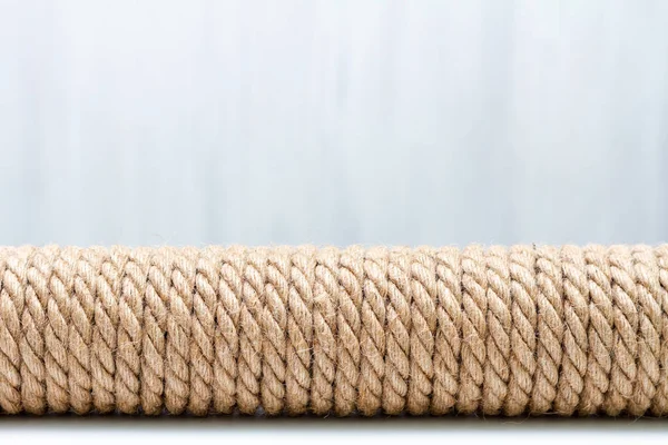 Sisal rope cat scratcher on white background. Copy space for text