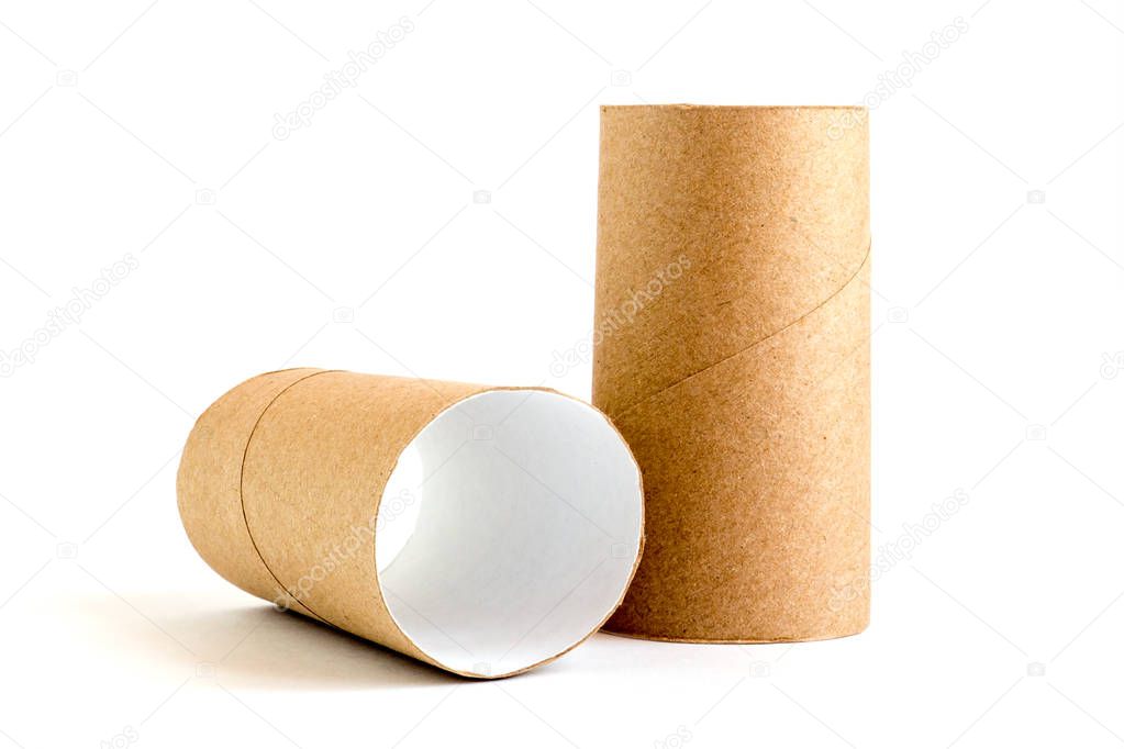 Two cardboard paper tubes on white background. Close-up of empty toilet rolls