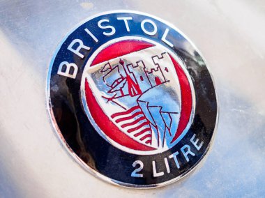 Ufa, Russia, 22 June 2019: The 7th Peking to Paris Motor Challenge. Close up of Bristol 403 Badge on boot lid clipart