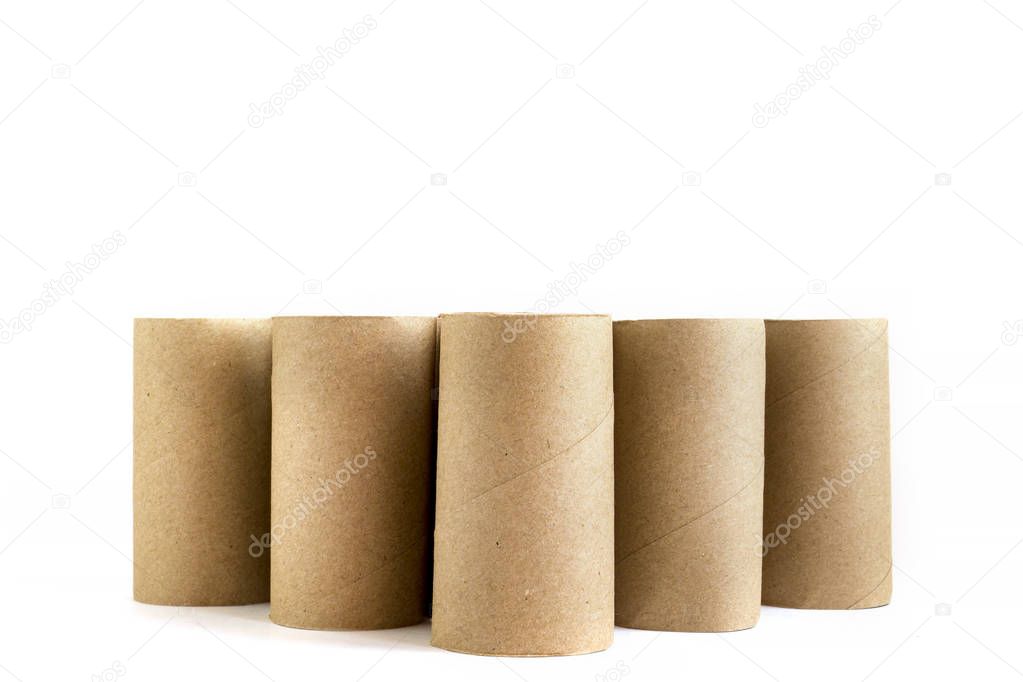 Five cardboard paper tubes on white background. Close-up of empty toilet rolls