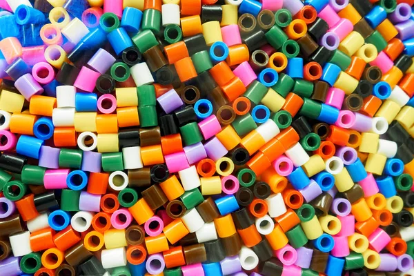 Assorted colors of Ikea Pyssla thermo mosaic beads, selective focus — Stock Photo, Image