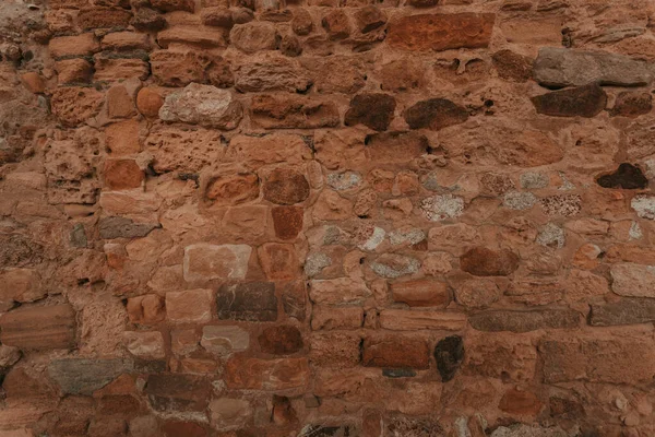 Stone wall texture/background,historical old ancient stone,preserved to our time, stones are laid evenly, solid construction has been standing for many centuries,ancient buildings,buildings and ruins