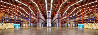 Warehouse industrial and logistics companies. Commercial warehouse. Huge distribution warehouse with high shelves. Low angle view. clipart
