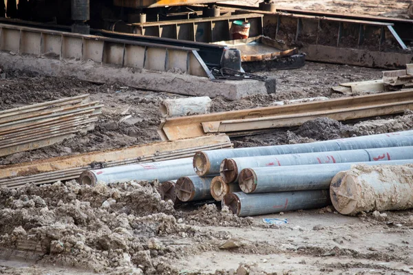 Open construction work site with heavy machinery equipment construction materials