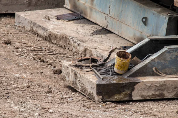 Open construction work site with heavy machinery equipment construction materials