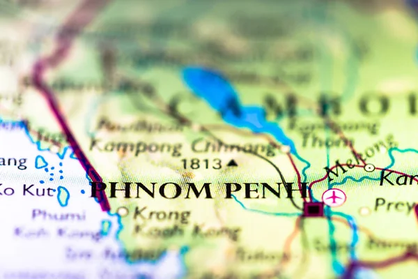 Shallow depth of field focus on geographical map location of Phnom Penh city in Cambodia Indochina Asia continent on atlas