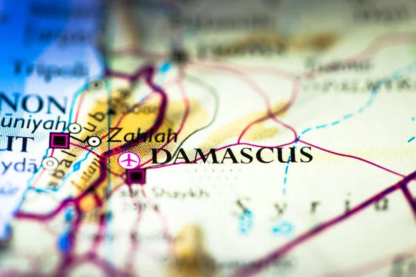 Shallow depth of field focus on geographical map location of Damascus Syria Arab Asia continent on atlas