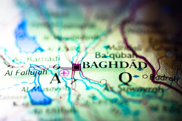 Shallow depth of field focus on geographical map location of Baghdad Iraq Arab Asia continent on atlas