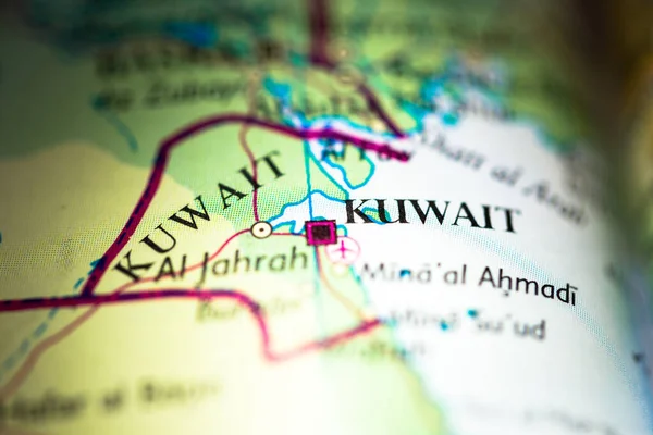 Shallow depth of field focus on geographical map location of Kuwait city in Kuwait Arab Asia continent on atlas