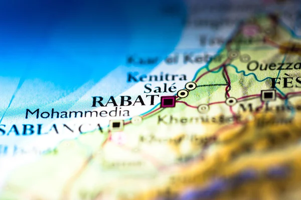 Shallow depth of field focus on geographical map location of Rabat city in Morocco Africa continent on atlas