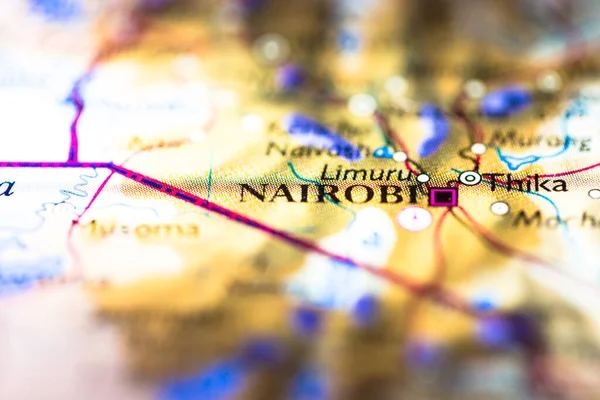 Shallow depth of field focus on geographical map location of Nairobi city in Kenya Africa continent on atlas