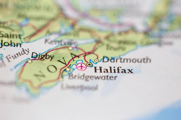 Shallow depth of field focus on geographical map location of Halifax Canada America continent on atlas