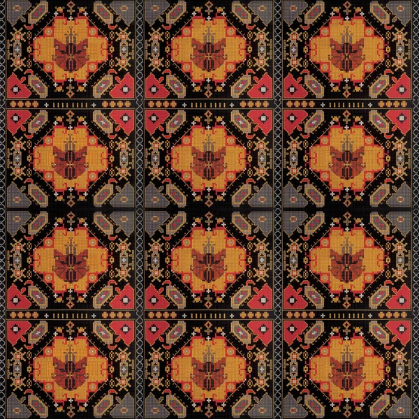 Geometrik figürler ve haç tekniğinde siyah bir zemin üzerinde kırmızı sarı gri tonlarda kedilerden oluşan bir süs.