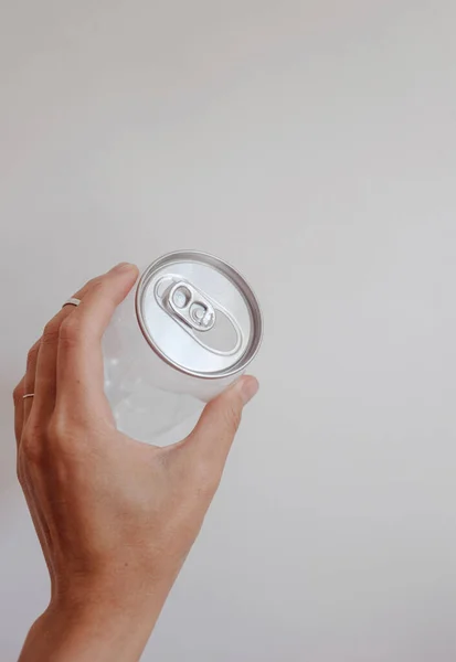 clean transparent can in the hand