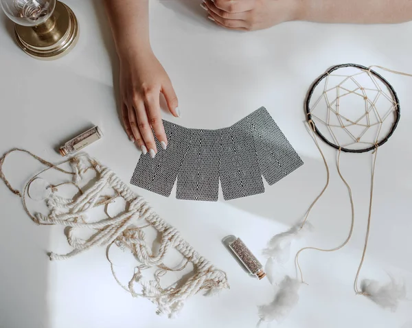 woman with tarot cards circle on the table