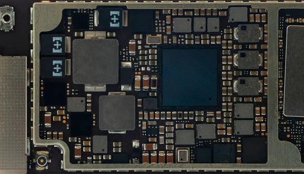 Smart phone components, circuit board from the modern mobile phone with CPU RAM chips and other electronic components. Miniaturization of a modern portable electronics.