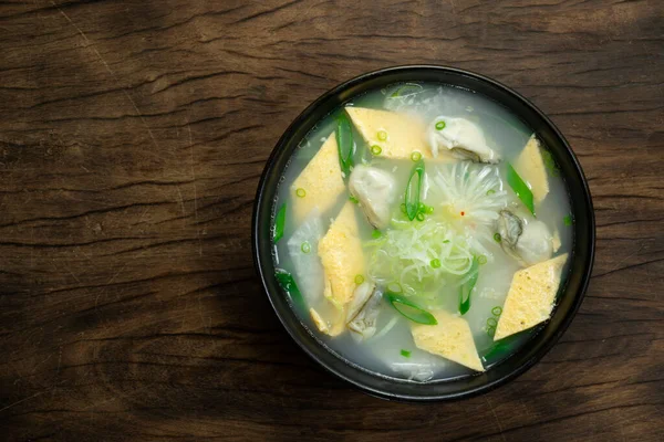 Oysters Soup with egg and radish Korean Food Style (Gulguk) refreashingly clear dish decorate with leek topview