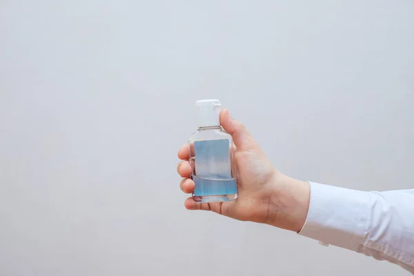 In my hand is a disinfectant alcohol gel — Stock Photo, Image