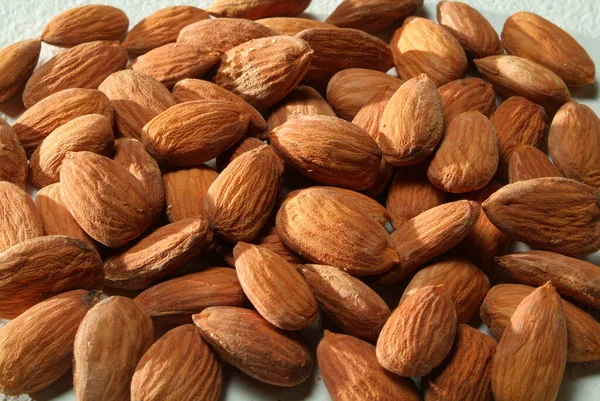 Textura Almendras Asadas Sobre Fondo Neutro — Foto de Stock