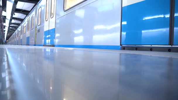Train with closed doors stands at the station. The metro train departs from the platform. Modern city, public transport. — Stock Footage Train with closed doors stands at the station. The metro train departs from the platform. Modern city, public transport. Royalty Free Stock Footage