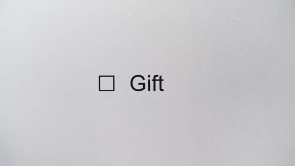 Mark a GIFT in a survey form. Postage marked as a GIFT. Hand draw a tick in checkbox — Stock Video